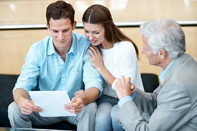 Buy stock photo Businessman, documents and couple with lawyer in office for legal advice, contract or investment. Man, woman or paper with attorney or advisor for asset management, insurance or policy in workplace