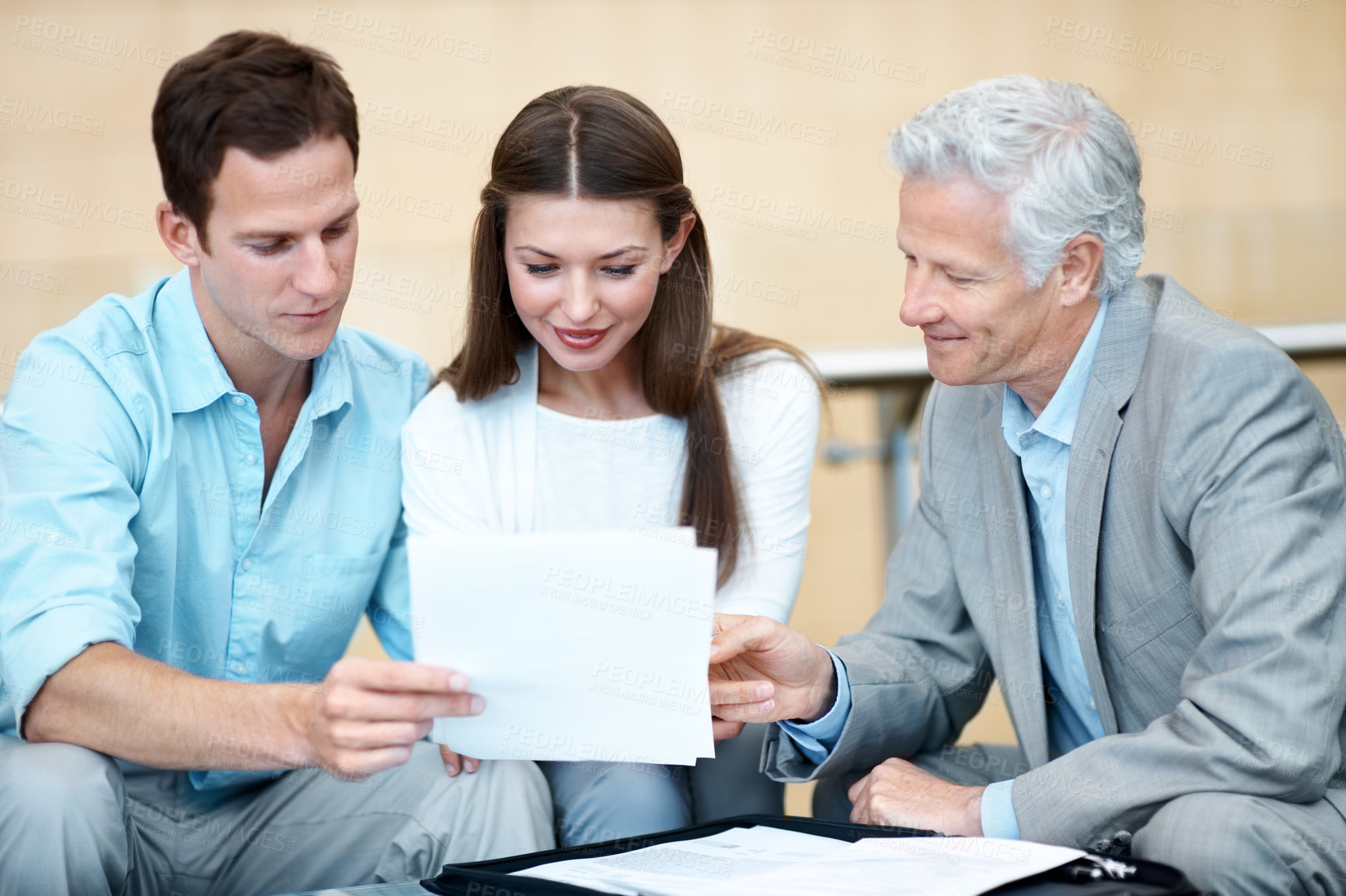 Buy stock photo Couple, reading and lawyer in office with document, contract and finance report for funding. Smile, people and attorney in workplace with paperwork, review budget and loan application for investment