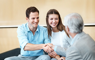 Buy stock photo Businessman, lawyer or handshake with happy couple for legal agreement or partnership in office. Man, woman or shaking hands with attorney, smile or thank you for business deal or assurance together