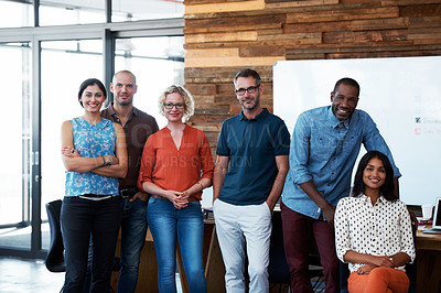 Buy stock photo Portrait of a diverse group of coworkers standing together in an office