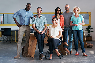 Buy stock photo Portrait of a diverse group of coworkers standing together in an office