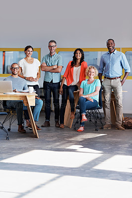 Buy stock photo Portrait of a diverse group of coworkers standing together in an office