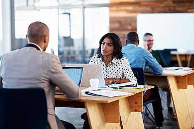 Buy stock photo Shot of a group of colleagues working in an office