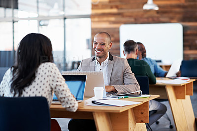 Buy stock photo Shot of a group of colleagues working in an office
