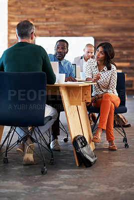 Buy stock photo Shot of a group of colleagues working in an office