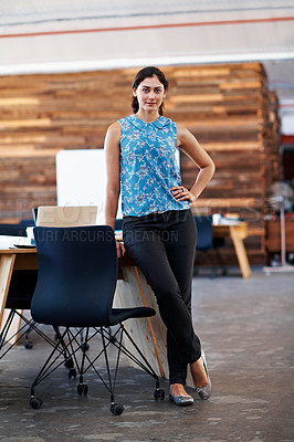 Buy stock photo Portrait of a young businesswoman standing in an office