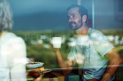 Buy stock photo Cropped shot of a couple having breakfast in the kitchen