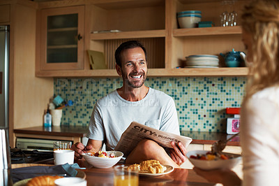 Buy stock photo Cropped shot of a couple having breakfast in the kitchen