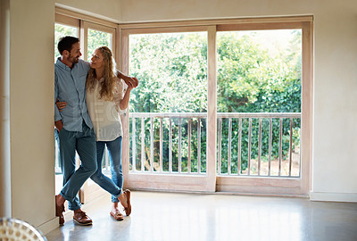 Buy stock photo Full length shot of a couple standing in their home