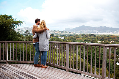 Buy stock photo Full length shot of a couple standing outside on their deck