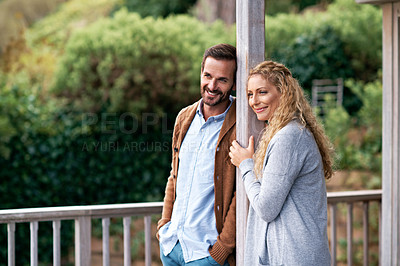 Buy stock photo Cropped shot of a couple standing outside on their deck