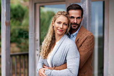 Buy stock photo Cropped shot of a couple standing outside on their deck