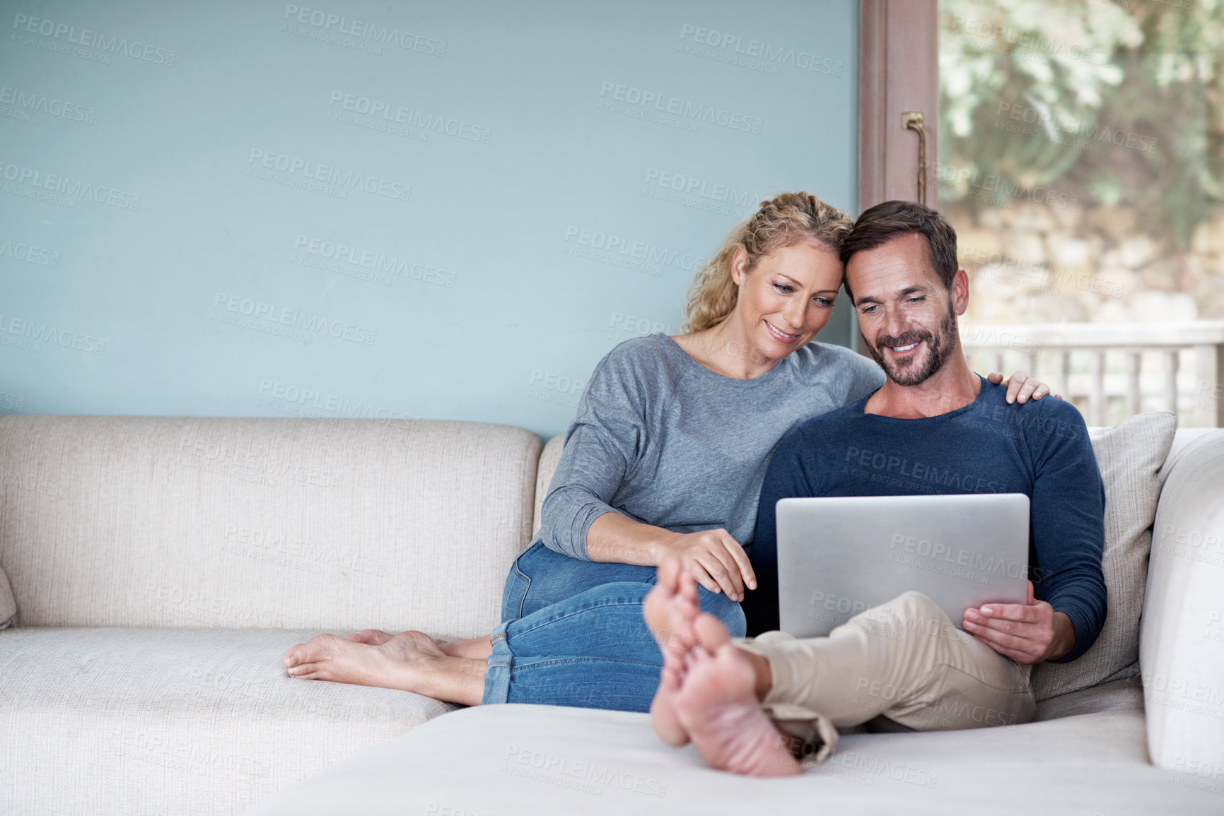 Buy stock photo Happy, couple and relax at house with laptop, social media and browsing website for latest movies. Space, mature people and bonding in home with tech, internet search and streaming for film watchlist