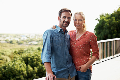 Buy stock photo Cropped portrait of an affectionate couple standing outside
