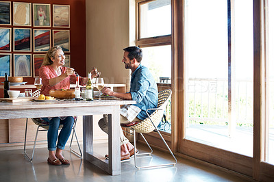 Buy stock photo Full length shot of a couple having a romantic dinner at home