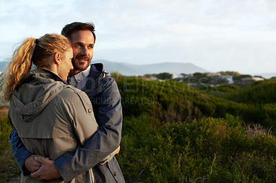 Buy stock photo Cropped shot of an affectionate couple standing outdoors