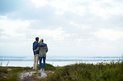 Buy stock photo Rearview shot of an affectionate couple standing outdoors