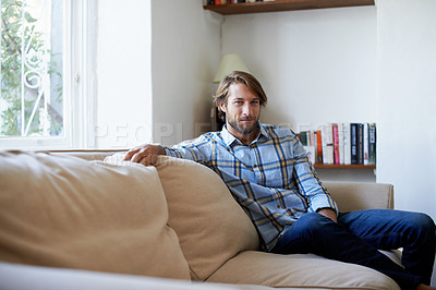 Buy stock photo Portrait of a young man relaxing at home
