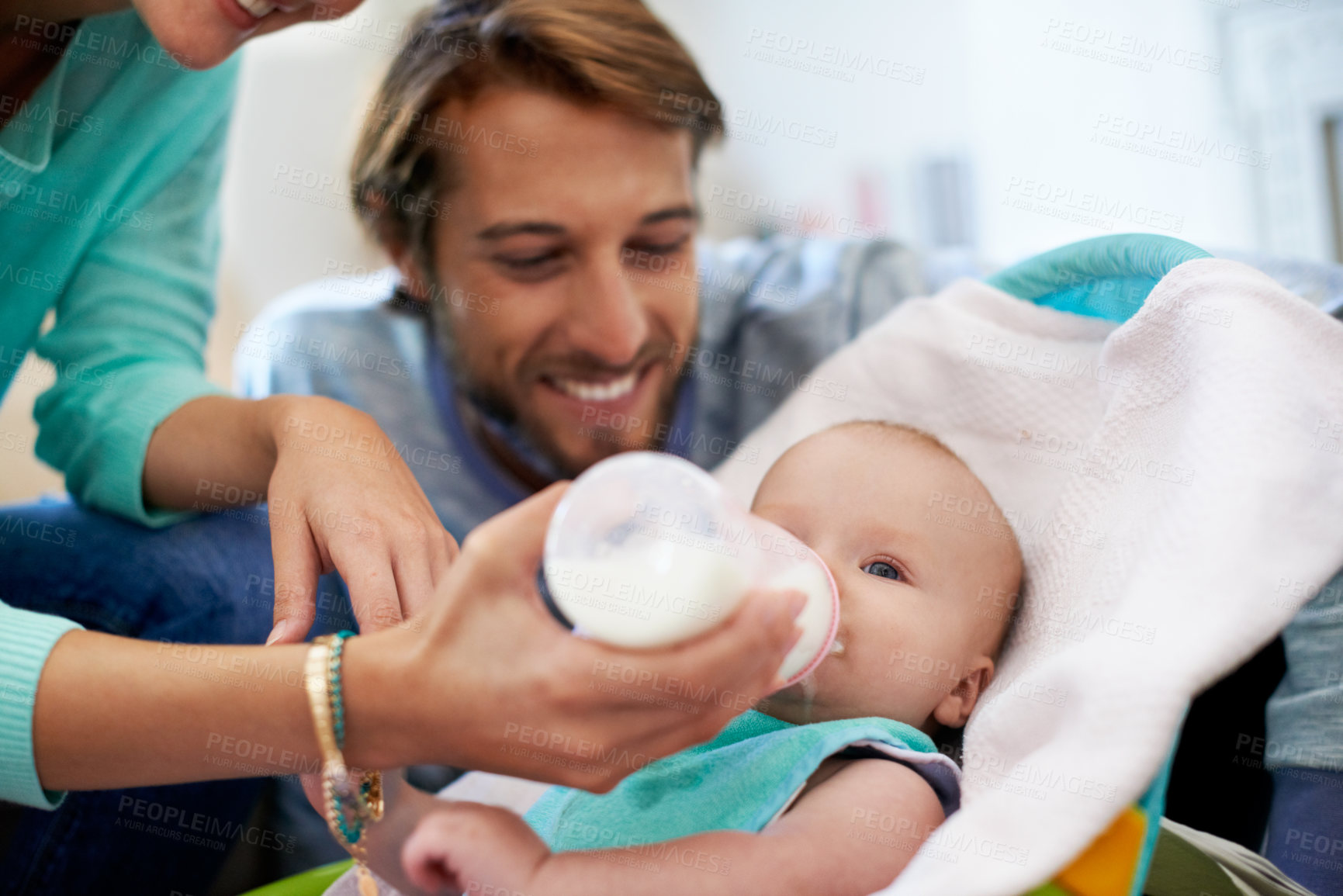Buy stock photo Family, baby and feeding with milk in home, bottle and nutrition for development and bonding. Parents, people and mother with food for child, formula and hungry with growth and health with parenting