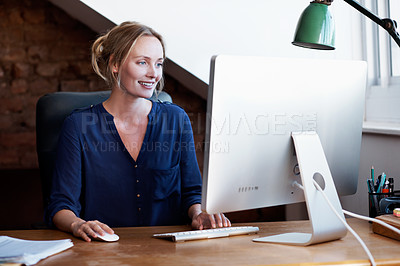 Buy stock photo Shot of a young woman using a computer in the study at home