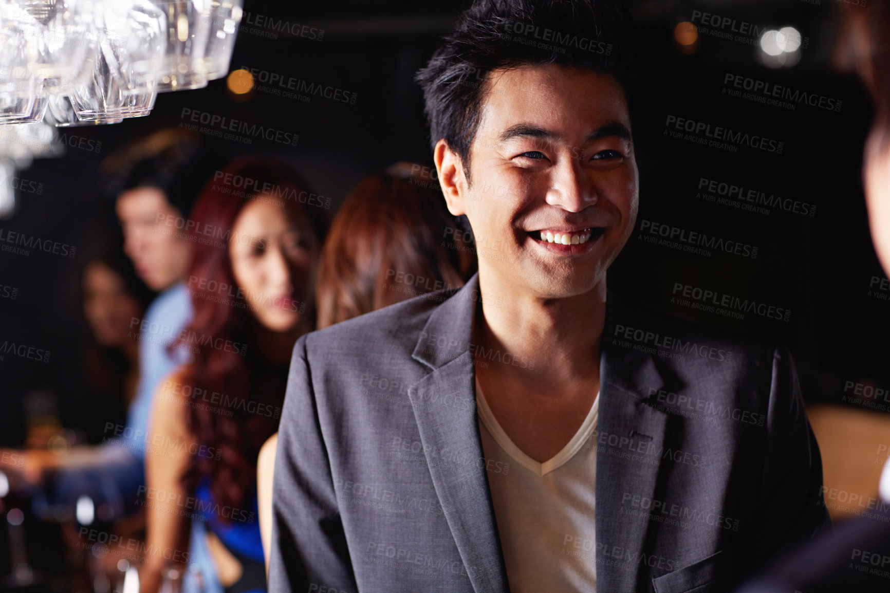 Buy stock photo Smile, party and laughing with asian man at club for social gathering, music festival and event. Celebration, weekend break and mixer with person at night for new years eve, disco and concert