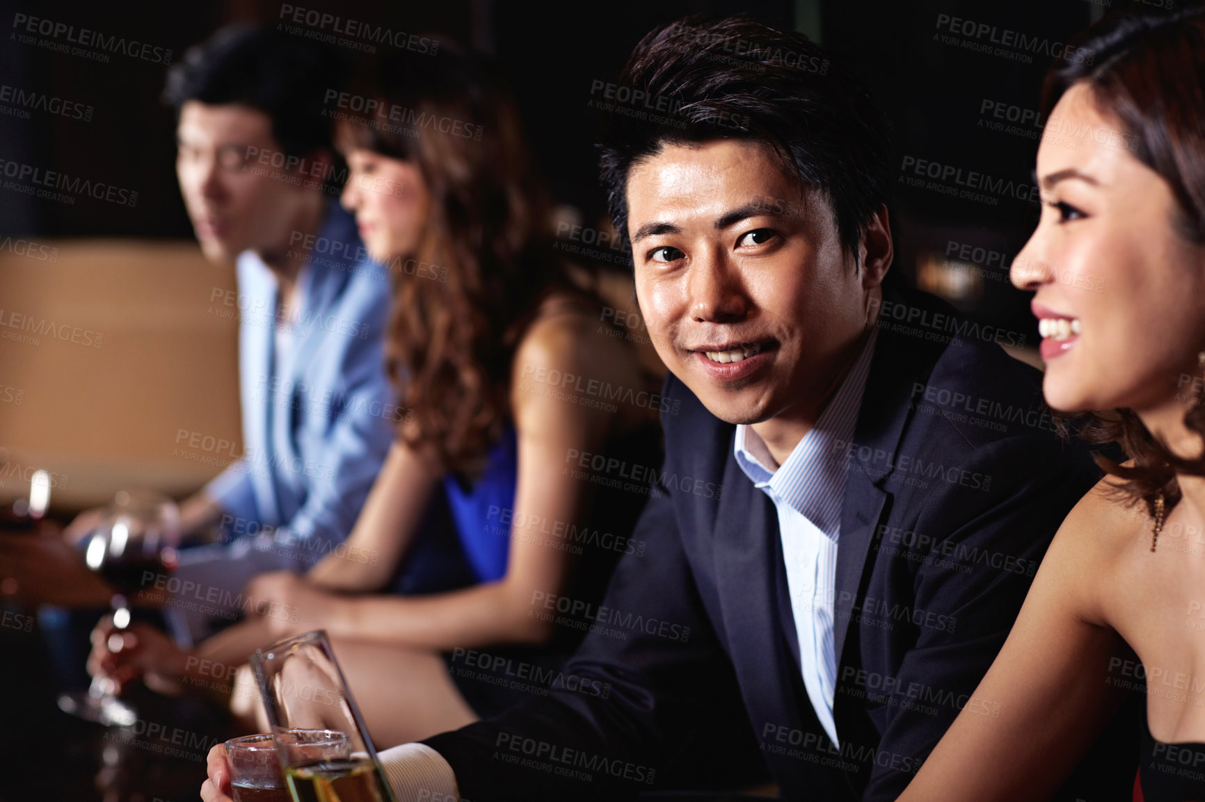 Buy stock photo Smile, wine and portrait with man at club for celebration, weekend break and social gathering. Alcohol, champagne and party with asian people at night pub for new years eve event, disco and culture