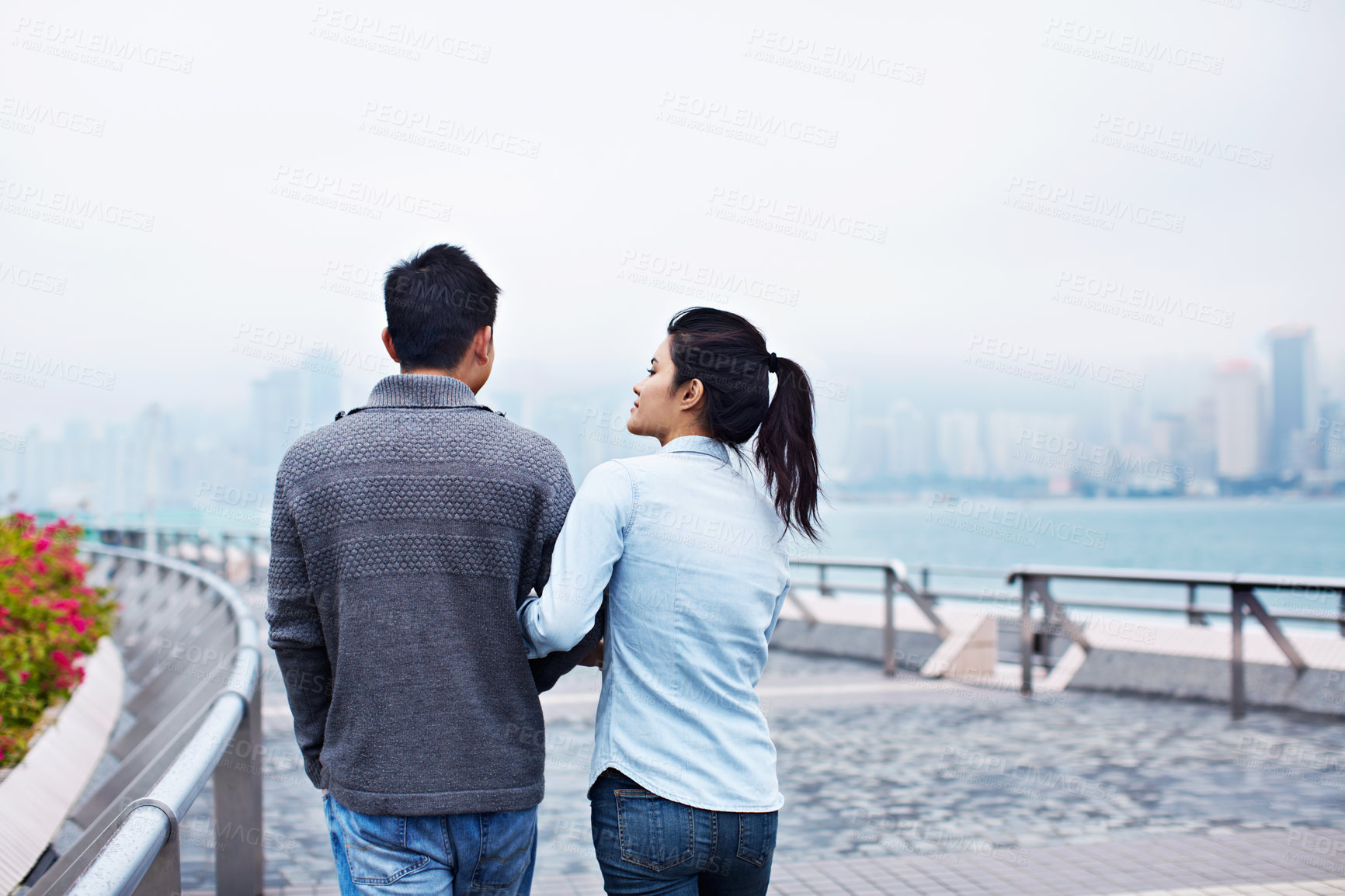 Buy stock photo Happy, walking and back of couple on bridge for bonding, connection and sightseeing together. Travel, city and man with woman outdoor for love, tourism and explore on holiday, vacation and weekend