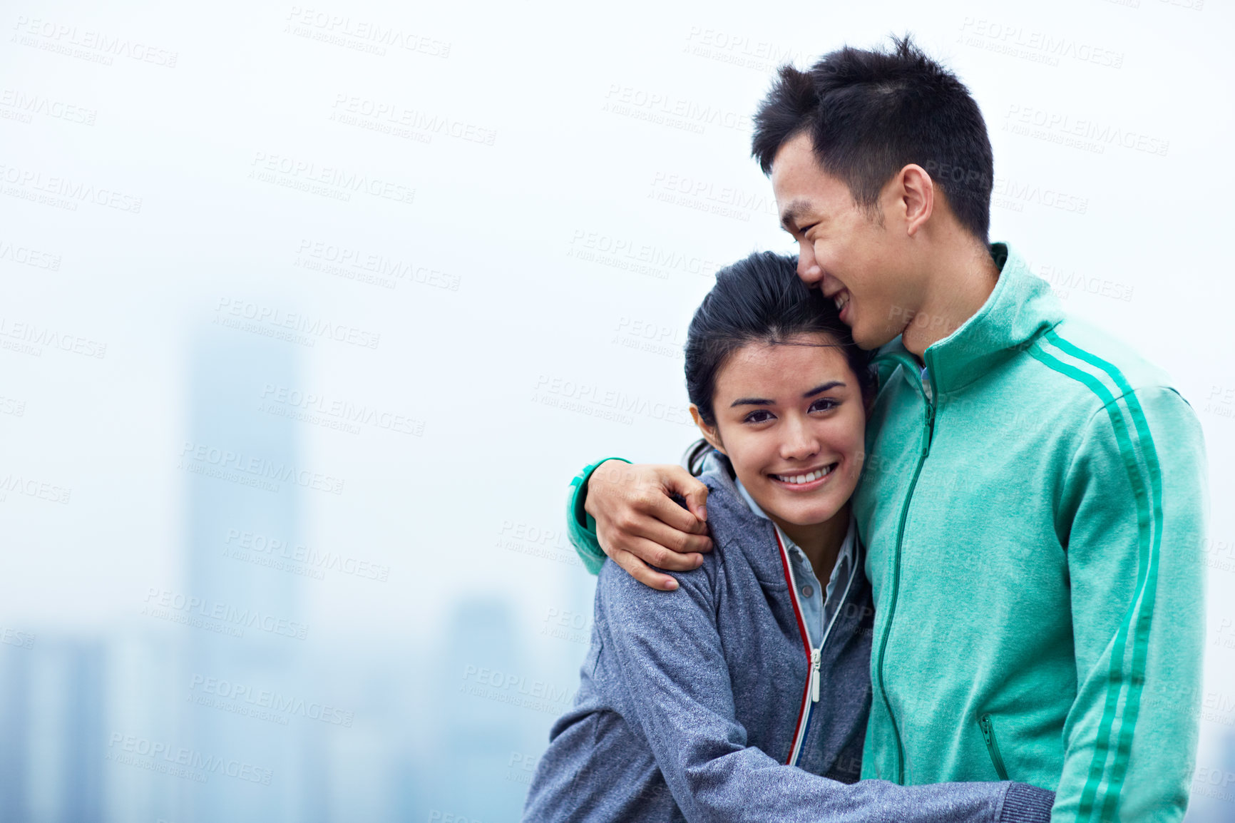 Buy stock photo Outdoor, hug and couple in city for exercise, workout or health with bonding together for challenge. Fitness, space and portrait of Asian woman embracing man with connection for cardio in town.
