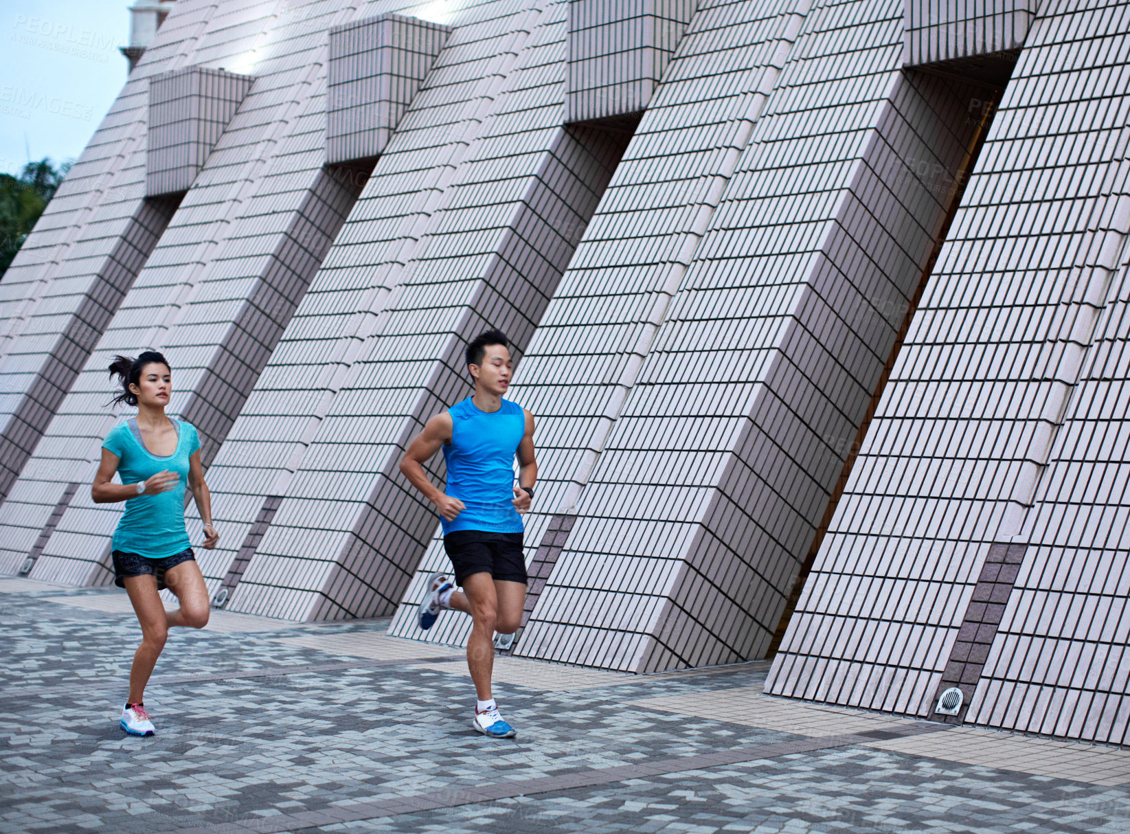 Buy stock photo Fitness, couple or running exercise in city for marathon practice, pace training or health. Active relationship, asian people and morning jog outdoor for race challenge, sport performance or wellness