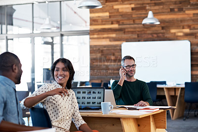 Buy stock photo Shot of a group of people working in an open office