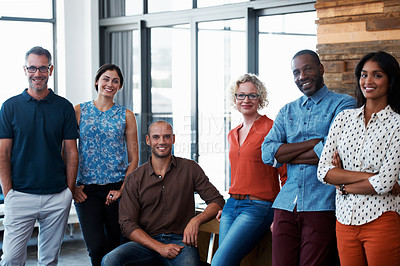 Buy stock photo Portrait of a group of coworkers standing together in an office