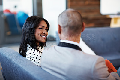 Buy stock photo Shot of two colleagues having a conversation at the office