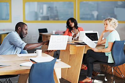 Buy stock photo Shot of a group of people working in an open office