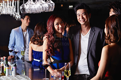 Buy stock photo Shot of two young asian couples enjoying a night out together