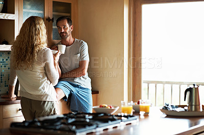 Buy stock photo Cropped shot of a couple having breakfast in the kitchen