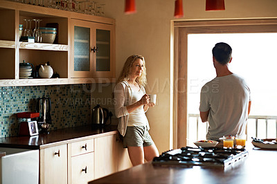 Buy stock photo Cropped shot of a couple having breakfast in the kitchen