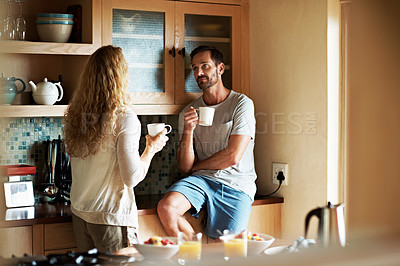 Buy stock photo Cropped shot of a couple having breakfast in the kitchen