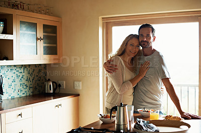 Buy stock photo Cropped shot of a couple having breakfast in the kitchen