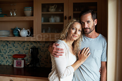 Buy stock photo Cropped shot of an affectionate couple in the kitchen
