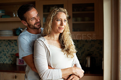 Buy stock photo Cropped shot of an affectionate couple in the kitchen