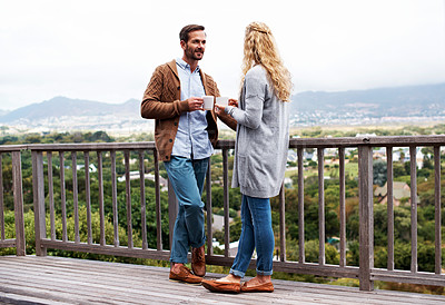 Buy stock photo Full length shot of a couple talking outside on their deck