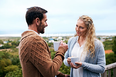 Buy stock photo Cropped shot of a couple talking outside on their deck