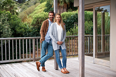 Buy stock photo Full length shot of a couple standing outside on their deck