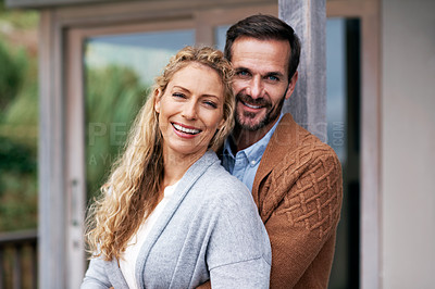 Buy stock photo Cropped shot of a couple standing outside on their deck