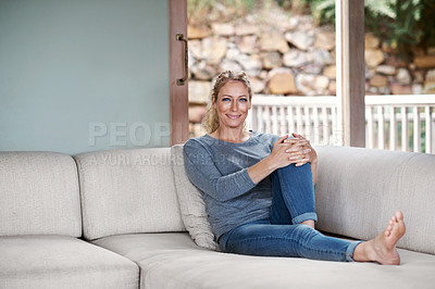 Buy stock photo Full length portrait of an attractive woman relaxing on her living room sofa