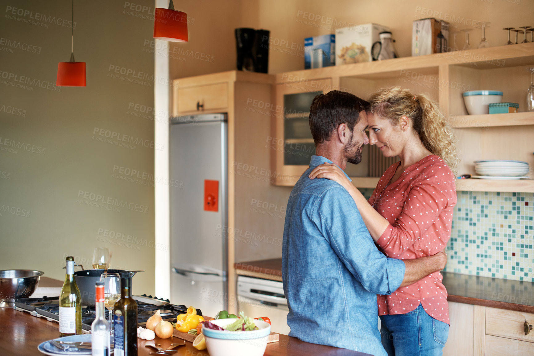 Buy stock photo Smile, love and couple with hug in kitchen for safety, care and marriage commitment together in home. Happy, connection and woman with man for relationship, bonding or weekend morning in apartment
