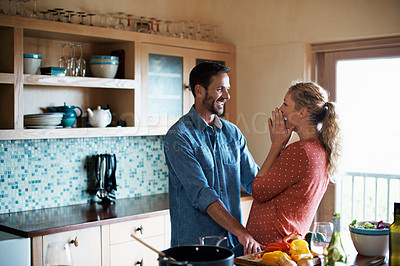 Buy stock photo Cropped shot of a couple cooking in the kitchen