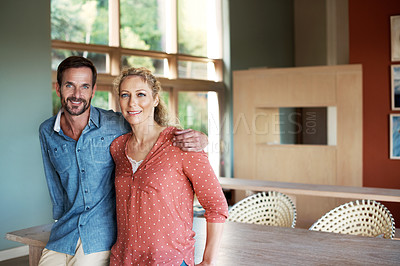 Buy stock photo Cropped portrait of an affectionate couple standing in their home