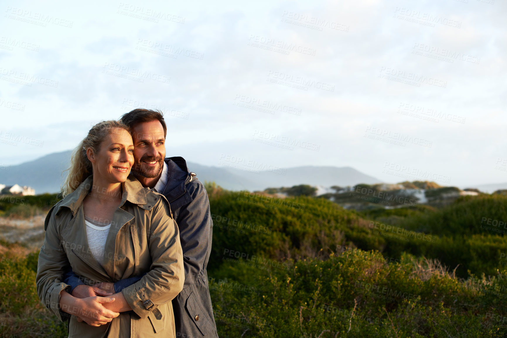 Buy stock photo Cropped shot of an affectionate couple standing outdoors