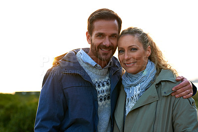 Buy stock photo Cropped portrait of an affectionate couple standing outdoors
